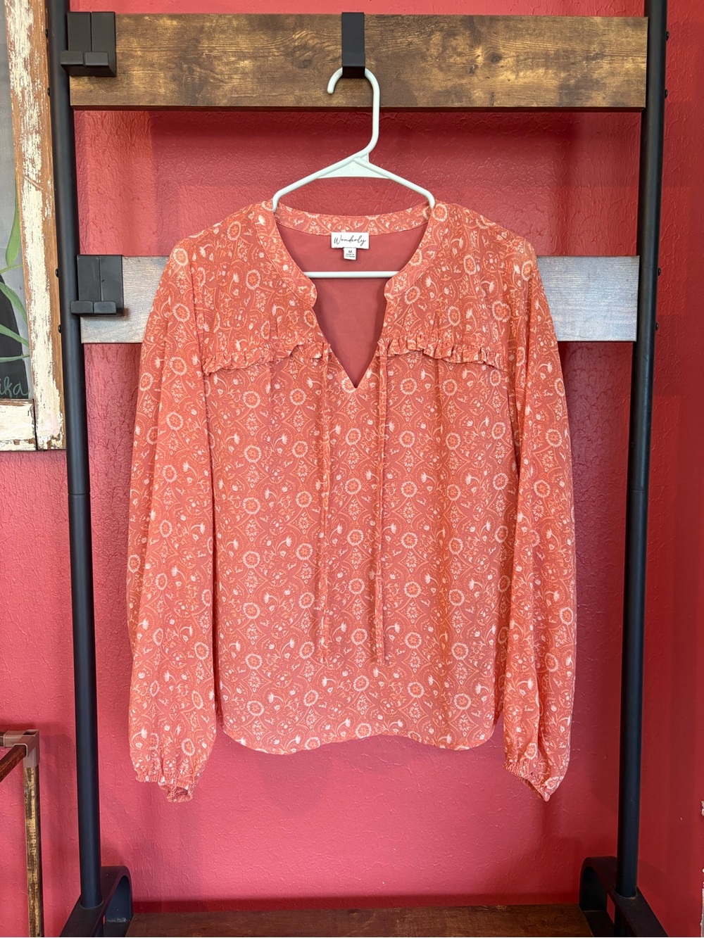 Wonderly long sleeved printed coral blouse size M